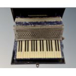 An Italia Cooperative L'Armonica Stradella de Luxe piano accordion in case.