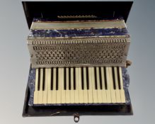 An Italia Cooperative L'Armonica Stradella de Luxe piano accordion in case.