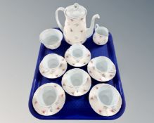 A tray containing a 15 piece Shelley pink rose patterned bone china tea service.