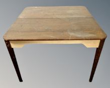 A mid-20th century dining table.