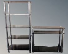 A contemporary black glass three tier side table together with matching five tier shelving unit.