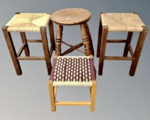 Three rush seated stools together with an antique beech stool.