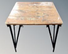 A mid-20th century folding wooden card table.