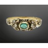 An 18ct yellow gold emerald and diamond ring, size M, 2.1g.