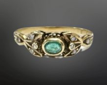 An 18ct yellow gold emerald and diamond ring, size M, 2.1g.