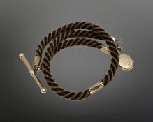 An antique hair Albert chain with gold T-bar, dog-catch and fittings.