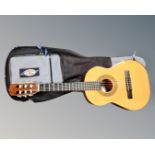 An Admira classical guitar with carry bag.