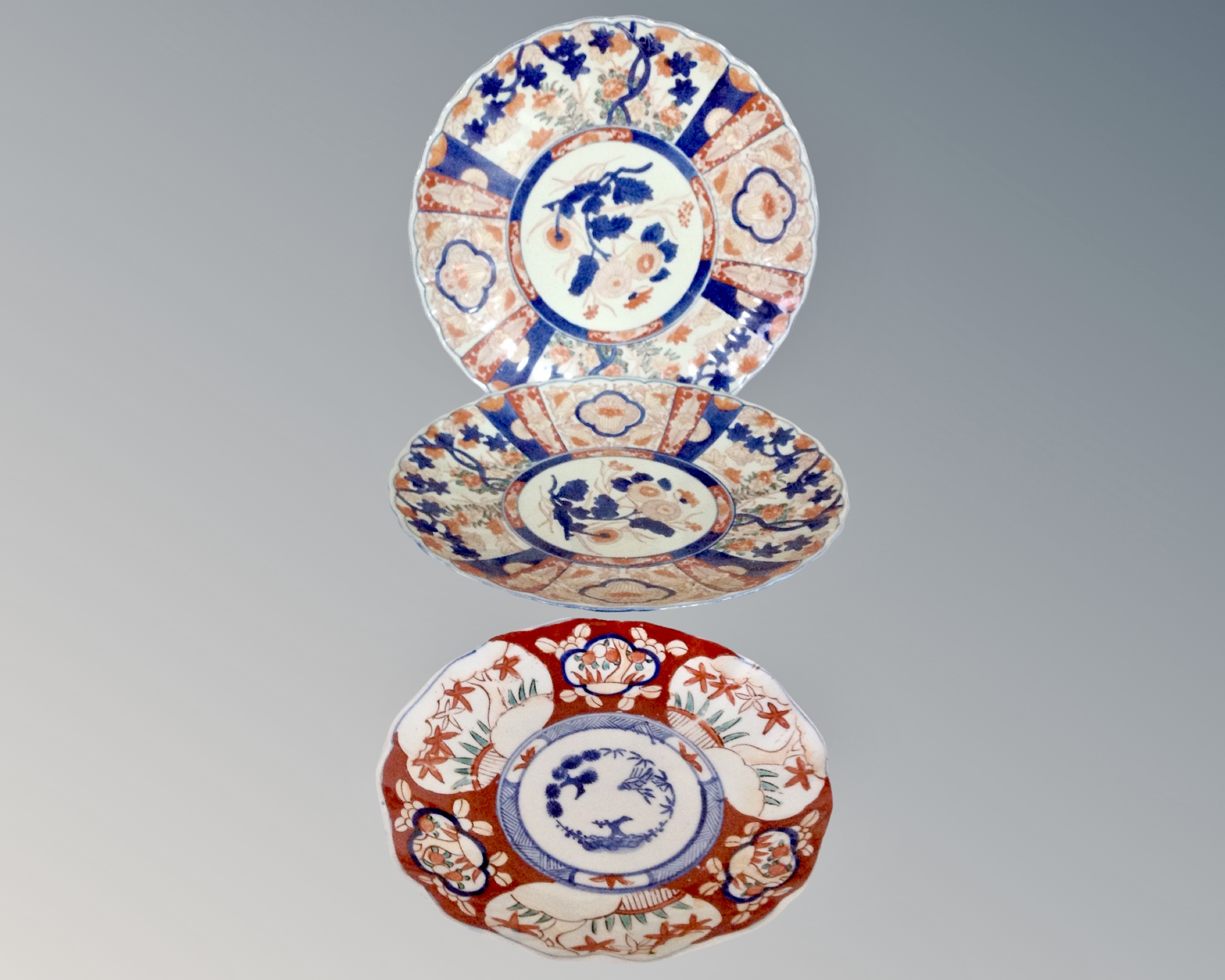 A pair of Imari scalloped edge dishes, width 31 cm,