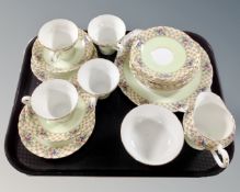 A tray containing a 19 piece Aynsley bone china tea service.