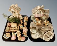 Two trays containing Pendelfin figures, stands and houses.