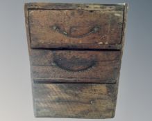 A tray and an antique pine three drawer chest containing rock and quartz samples.