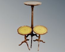 A pair of wine tables with leather inset panels together with a similar torchère.