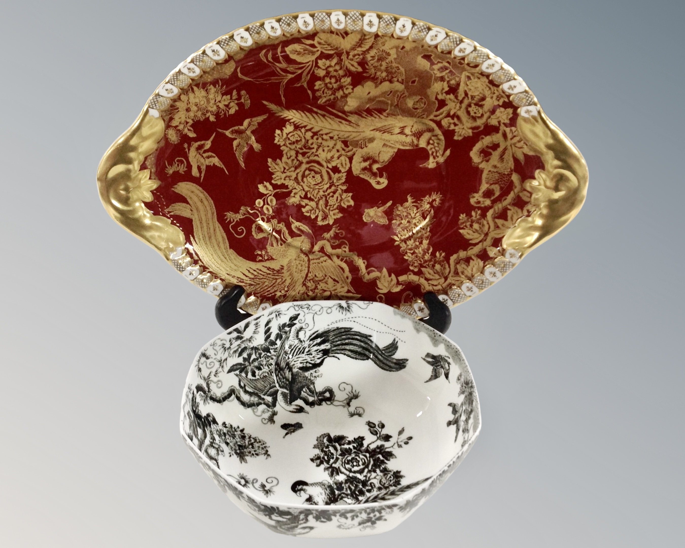 A Royal Crown Derby birds of paradise tureen stand on maroon ground together with a further Royal