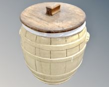 A vintage glazed stoneware lidded crock pot in the form of a barrel.