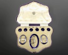 A fine quality cased silver gilt and purple enamel buckle, pair of shoe buckles, and six buttons,
