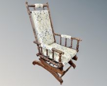 A vintage beechwood American rocking chair.