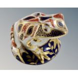 A Royal Crown Derby frog paperweight with silver stopper.