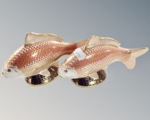 Two Royal Crown Derby golden carp paperweights, one with silver stopper.