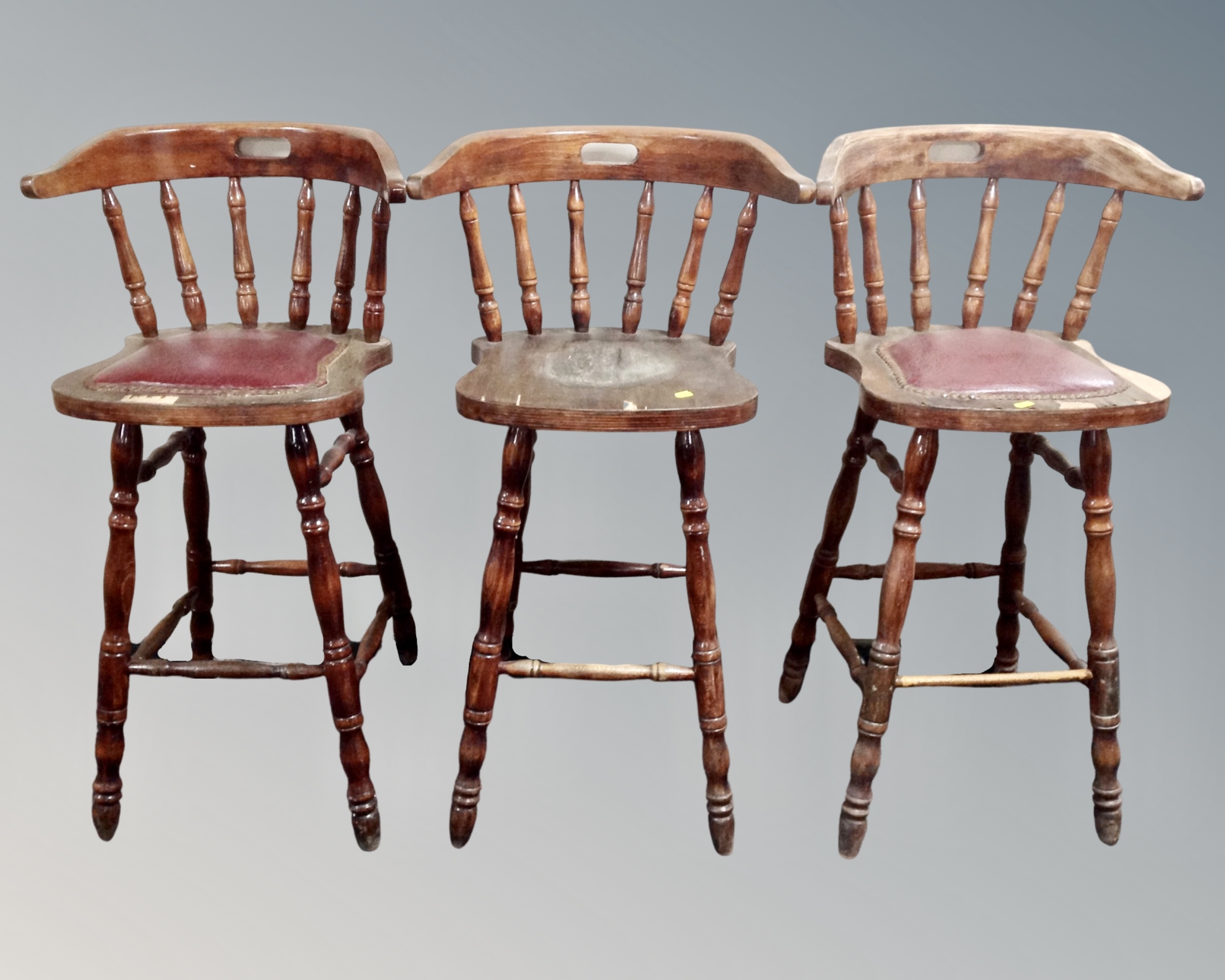 Three beech wood bar stools.