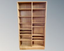 A teak effect open bookcase.