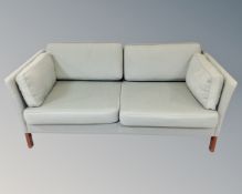 A late 20th century Scandinavian two seater settee in turquoise fabric,