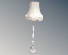 An alabaster standard lamp together with two similar table lamps.