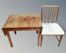 A 19th century continental mahogany drop leaf table together with a dining chair.