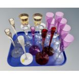 A tray of assorted gilt and coloured drinking glasses and candle sticks