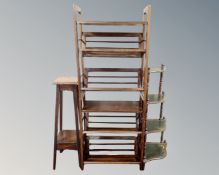An Edwardian oak jardiniere stand together with a shoe rack and a four tier corner whatnot.