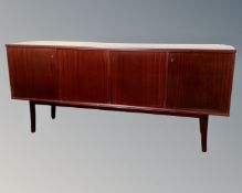 A continental stained teak four door sideboard.