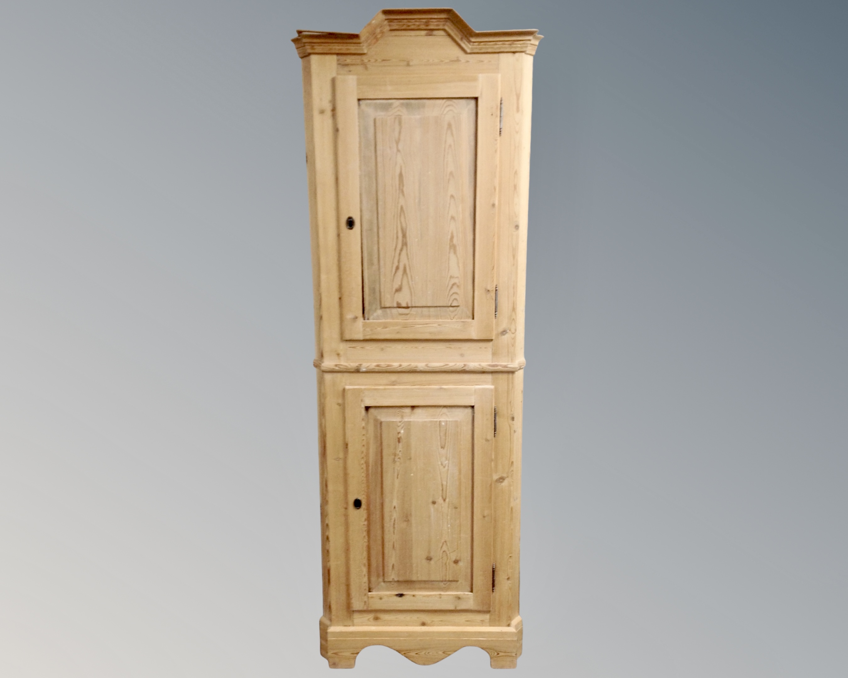 A 19th century pine corner cabinet.