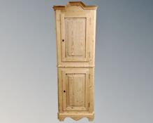 A 19th century pine corner cabinet.