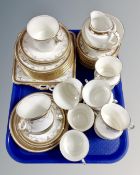 A tray of forty three pieces of Fenton Milo gilt porcelain tea china together with a similar milk