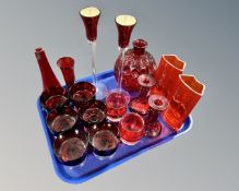 Approximately seventeen pieces of ruby glass ware, pair of candlestick bases, pair of Ikea vases,