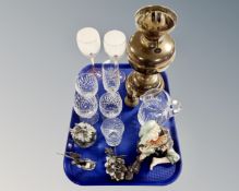 A tray of brass oil lamp base, Turkish brass nutmeg grinder, crystal wine glasses,