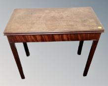 A George III mahogany turnover top card table.