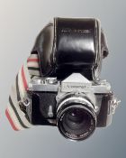A vintage Nikkormat FTN camera in original case, Praktica MTL3 and MTL5 cameras.