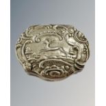 A continental embossed silver snuff box, depicting a running stag, width 6cm.