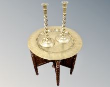 A Moorish brass topped and bone inlaid circular table together with a pair of brass barleytwist