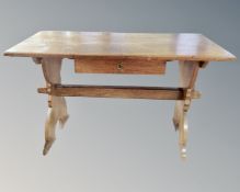 A 19th century oak refectory table fitted with a drawer.