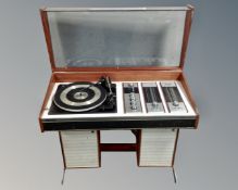 A Decca Sound turntable with integrated speakers in rosewood effect case CONDITION