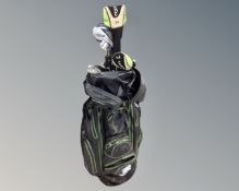 A golf bag containing assorted irons and drivers,