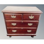 A 19th century stained pine four drawer chest.