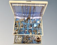 A lift out jewellery box containing a quantity of costume jewellery, rings, necklaces,