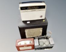 A box of vintage radios and telephone hand set
