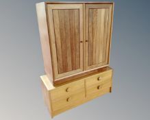 A teak effect double door cabinet together with a four drawer low chest.