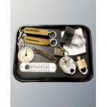 A tray of padlocks, enamelled thermometer,