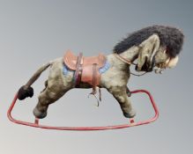 A vintage child's Merrythought rocking horse.