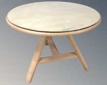 A contemporary circular Arts and Crafts style dining table with plate glass top (width 104cm)