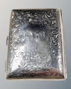 An etched silver cigarette case by John Rose, Birmingham 1903, 62g.